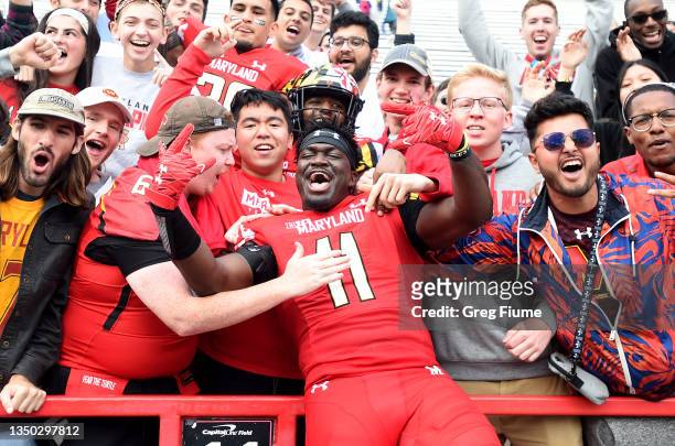 Ruben Hyppolite II of the Maryland Terrapins celebrates with fans after a 38-35 victory against the Indiana Hoosiers at Capital One Field at Maryland...