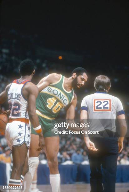 James Donaldson of the Seattle Supersonics talks with an official against the Washington Bullets during an NBA basketball game circa 1982 at the...