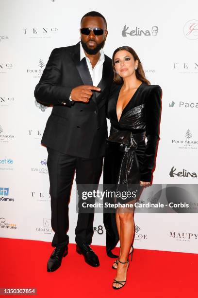 Gandhi Djuna aka Maître Gims and Eva Longoria attend the photocall during the Global Gift Gala 2021 at Four Seasons Hotel George V on October 30,...