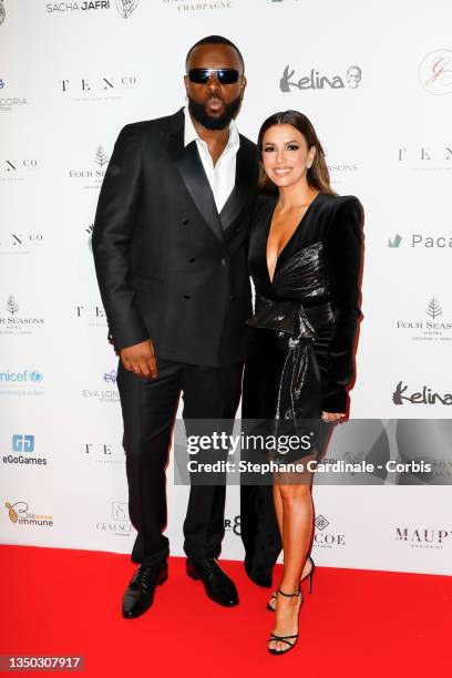 Gandhi Djuna aka Maître Gims and Eva Longoria attend the photocall during the Global Gift Gala 2021 at Four Seasons Hotel George V on October 30,...