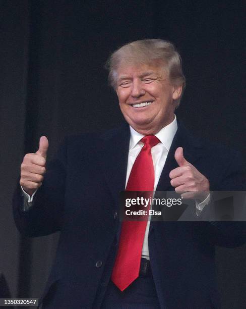 Former president of the United States Donald Trump gives a thumbs up prior to Game Four of the World Series between the Houston Astros and the...