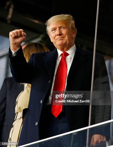 Former president of the United States Donald Trump waves prior to Game Four of the World Series between the Houston Astros and the Atlanta Braves...