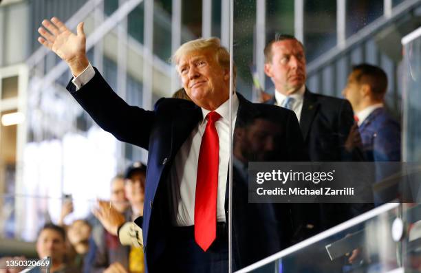 Former president of the United States Donald Trump waves prior to Game Four of the World Series between the Houston Astros and the Atlanta Braves...