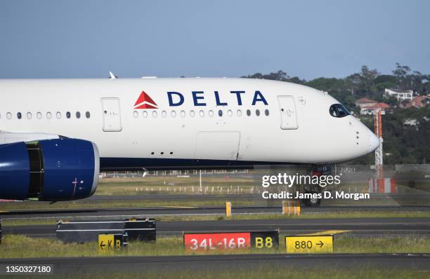 Delta airlines aircraft landing from Los Angeles at Kingsford Smith International airport on October 31, 2021 in Sydney, Australia. Australia's...