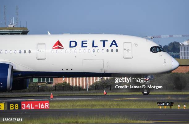 Delta airlines aircraft landing from Los Angeles at Kingsford Smith International airport on October 31, 2021 in Sydney, Australia. Australia's...