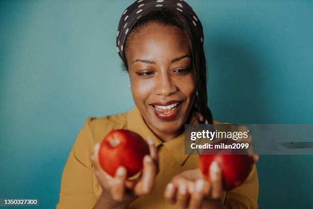 portrait of a beautiful african-american - apple milan stock pictures, royalty-free photos & images