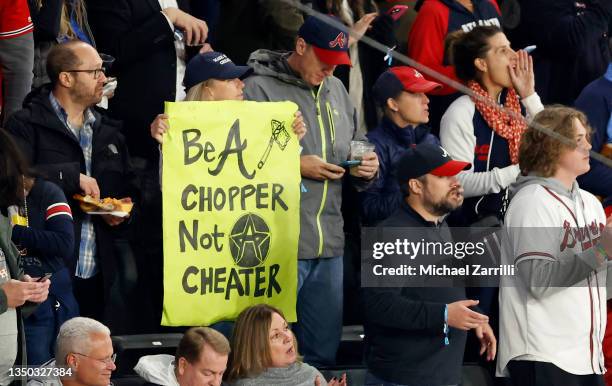 Fan holds a sign in Game Four of the World Series between the Houston Astros and the Atlanta Braves at Truist Park on October 30, 2021 in Atlanta,...