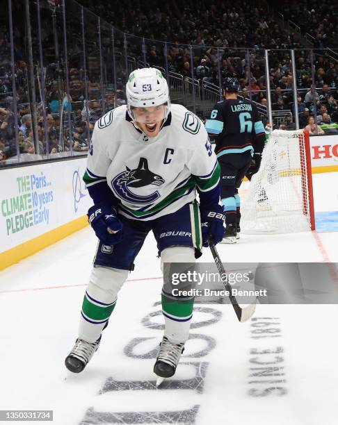 Bo Horvat of the Vancouver Canucks skates against the Seattle Kraken during the franchise's inaugural home game at the Climate Pledge Arena on...