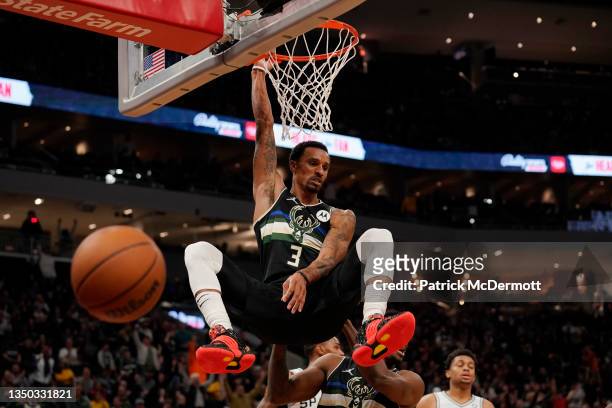 George Hill of the Milwaukee Bucks dunks the ball against the San Antonio Spurs in the first half at Fiserv Forum on October 30, 2021 in Milwaukee,...