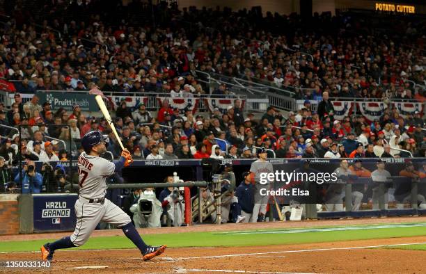 Jose Altuve of the Houston Astros hits a solo home run against the Atlanta Braves during the fourth inning in Game Four of the World Series at Truist...