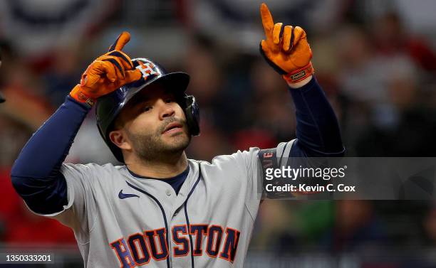 Jose Altuve of the Houston Astros celebrates after hitting a solo home run against the Atlanta Braves during the fourth inning in Game Four of the...