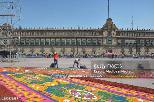 City government workers finish details for a massive offering dedicated to the indigenous communities to mark Day of the Dead at Plancha del Zócalo...