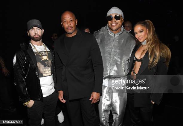 Eminem, Dr. Dre, LL Cool J, and Jennifer Lopez pose backstage during the 36th Annual Rock & Roll Hall Of Fame Induction Ceremony at Rocket Mortgage...