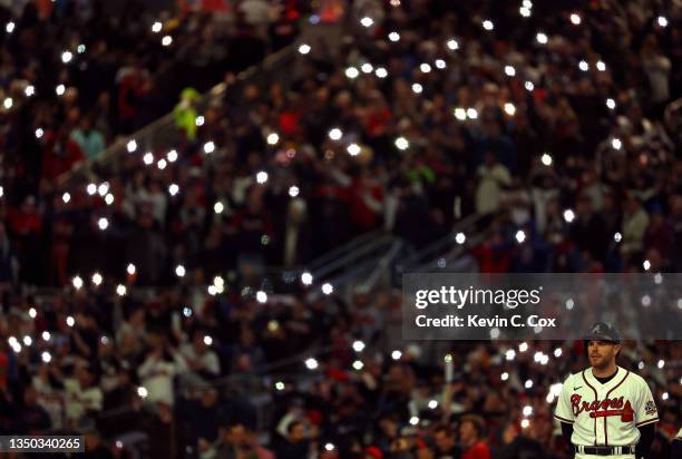 Fans do "the chop" during the sixth inning in Game Four of the World Series between the Houston Astros and the Atlanta Braves at Truist Park on...