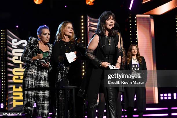 Jane Wiedlin, Belinda Carlisle, Kathy Valentine, and Gina Schock of The Go-Go's speak onstage during the 36th Annual Rock & Roll Hall Of Fame...