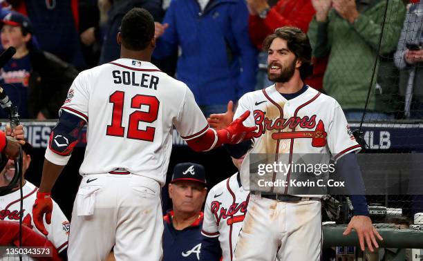 Jorge Soler of the Atlanta Braves is congratulated by Dansby Swanson after they hit back-to-back solo home runs against the Houston Astros during the...