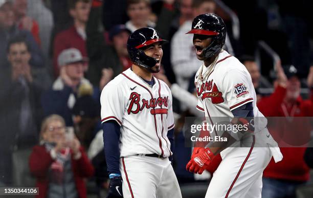 Jorge Soler of the Atlanta Braves is congratulated by Eddie Rosario after hitting a solo home run against the Houston Astros during the seventh...