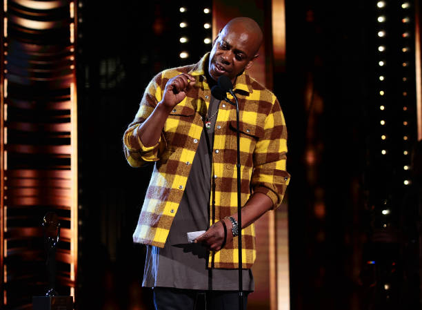 Dave Chappelle speaks onstage during the 36th Annual Rock & Roll Hall Of Fame Induction Ceremony at Rocket Mortgage Fieldhouse on October 30, 2021 in...