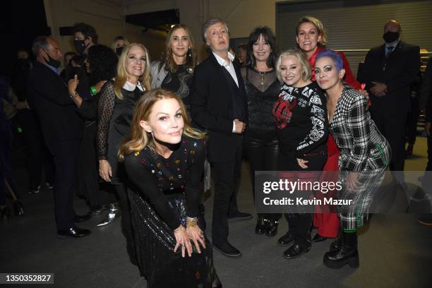 Belinda Carlisle, Charlotte Caffey, Nancy Shevell, Paul McCartney, Kathy Valentine, Gina Schock, Brandi Carlile, and Jane Wiedlin pose backstage...