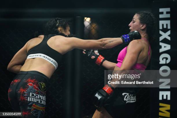 Lucie Bertaud slips a right cross punch from Karla Benitez during the Mixed Martial Arts fights event "Hexagone MMA 2" at Zenith de La Villette, on...