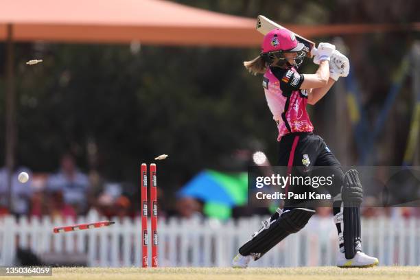 Ellyse Perry of the Sixers is bowled by Taneale Peschel of the Scorchers during the Women's Big Bash League match between the Perth Scorchers and the...