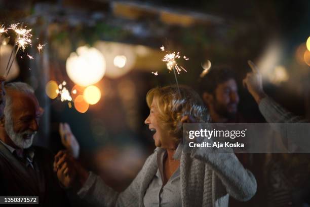 family new year's eve party. - family new year's eve stock pictures, royalty-free photos & images