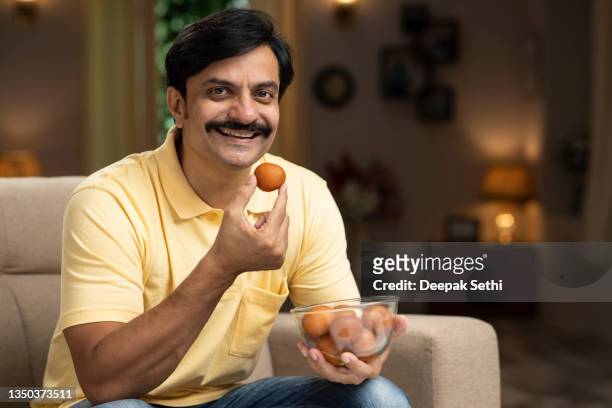 man eating sweet food, stock photo - temptation stock pictures, royalty-free photos & images