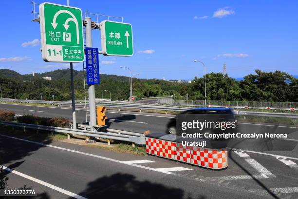 joban expressway and hitachi chuo toll road exit signboard - japanese exit sign stock pictures, royalty-free photos & images