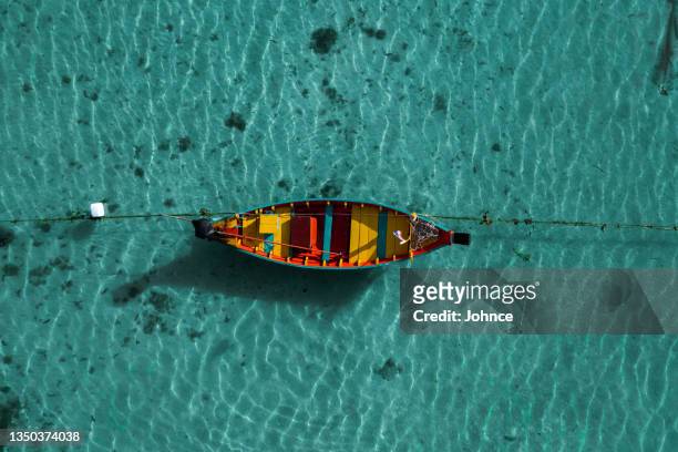 colorful long tail boat - seascape stock pictures, royalty-free photos & images