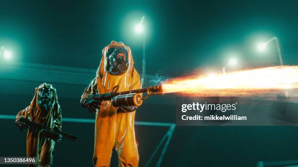 exterminator  cleans the streets a night with flamethrower - epidemie stock pictures, royalty-free photos & images