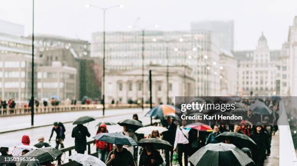 a daytime view of rain on london bridge - stock photo - shower stock pictures, royalty-free photos & images