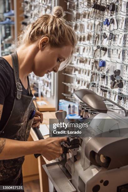 female key maker in store reopening - locksmith stock pictures, royalty-free photos & images