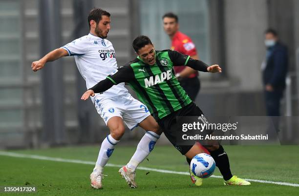 Riccardo Marchizza of Empoli FC competes for the ball with Giacomo Raspadori of US Sassuolo during the Serie A match between US Sassuolo and Empoli...