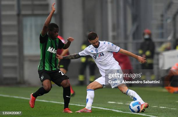 Hamed Traore of US Sassuolo competes for the ball with Petar Stojanovic of Empoli FC during the Serie A match between US Sassuolo and Empoli FC at...