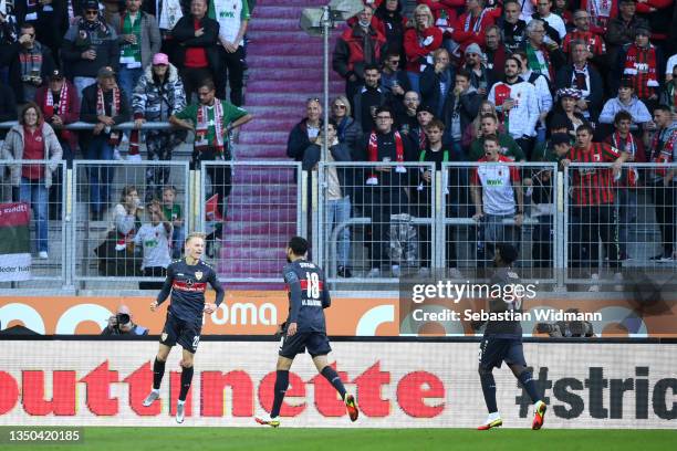 Chris Fuehrich of VfB Stuttgart celebrates after scoring their side's first goal during the Bundesliga match between FC Augsburg and VfB Stuttgart at...