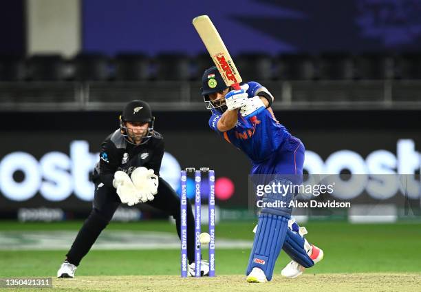 Virat Kohli of India bats as Devon Conway of New Zealand looks on during the ICC Men's T20 World Cup match between India and NZ at Dubai...