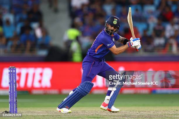 Virat Kohli of India hits a single during the ICC Men's T20 World Cup match between India and NZ at Dubai International Stadium on October 31, 2021...