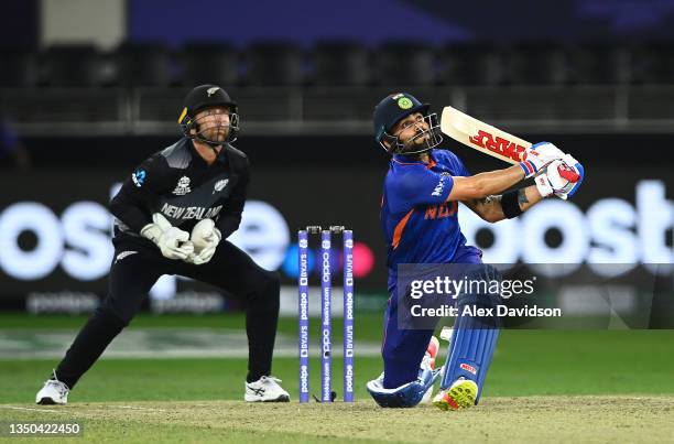 Virat Kohli of India is caught out by Trent Boult as Devon Conway of New Zealand looks on during the ICC Men's T20 World Cup match between India and...