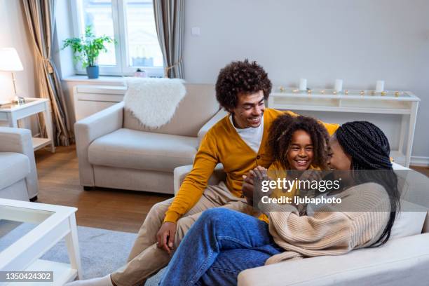 we are one happy family - family at home stock pictures, royalty-free photos & images