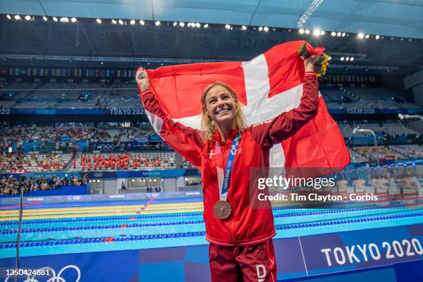 Bronze medal winner Pernille Blume of Denmark with her medal after the Women's 50m Freestyle final at the Tokyo Aquatic Centre during the Tokyo 2020...