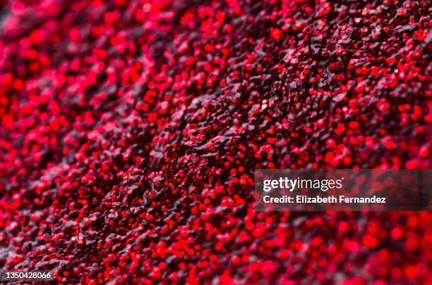 red glitter background with a narrow focus - red enamel stock pictures, royalty-free photos & images