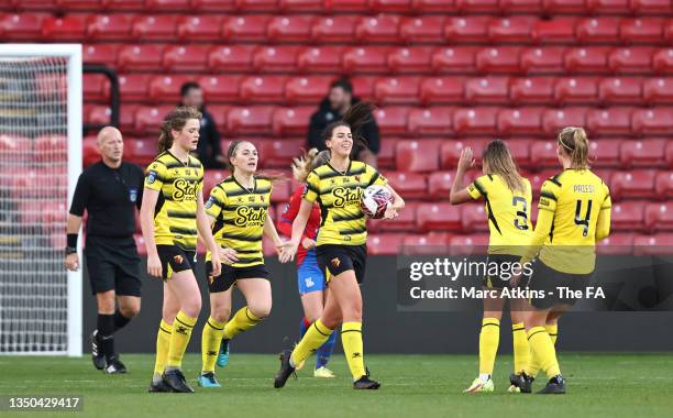 Anaisa Harney of Watford celebrates with teammates after scoring their side's second goal during the Barclays FA Women's Championship match between...