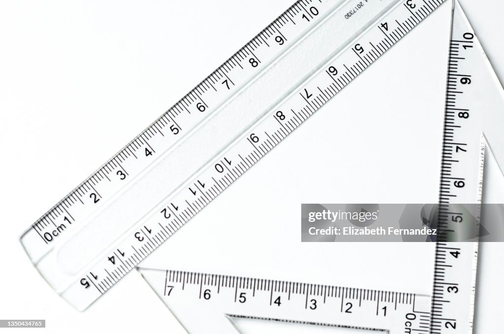 Various rulers of different shapes on white background