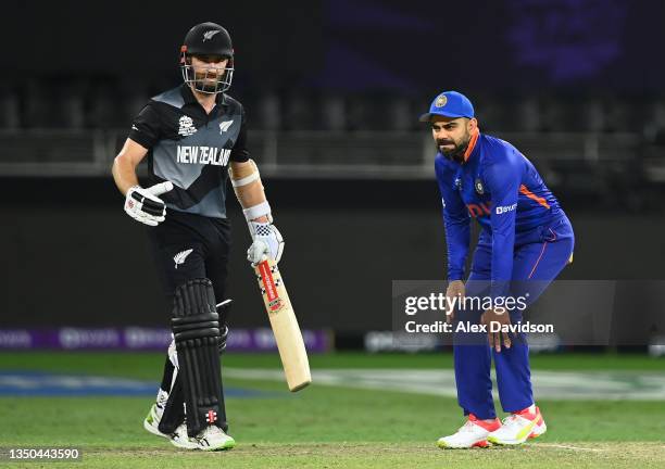 Kane Williamson of New Zealand interacts with Virat Kohli of India during the ICC Men's T20 World Cup match between India and NZ at Dubai...