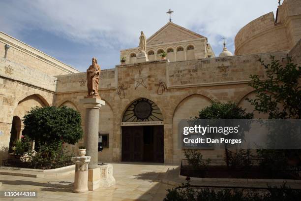 church of st. catherine and sculpture of st. jerome in bethlehem - st. catherine stock pictures, royalty-free photos & images