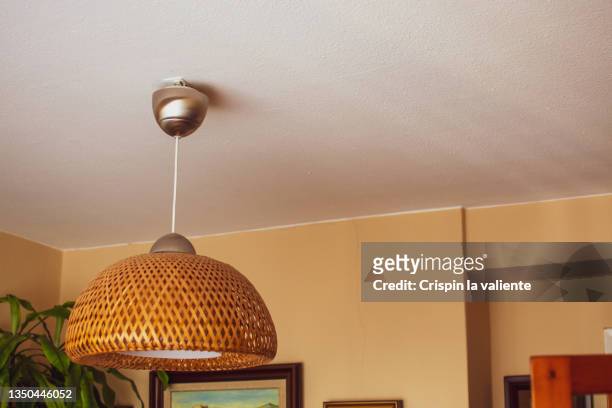 detail of rustic ceiling lamp in the living room, decoration - cosy living ceiling stock-fotos und bilder