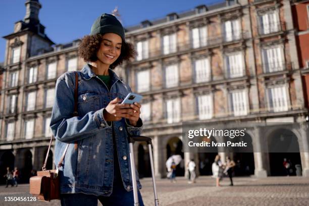 young solo traveler woman in madrid street - study abroad stock pictures, royalty-free photos & images