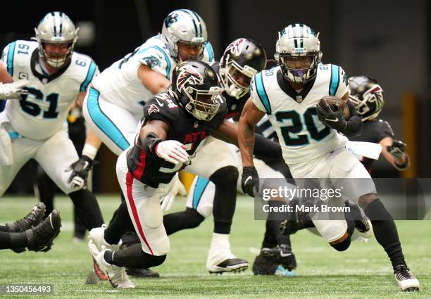 Ameer Abdullah of the Carolina Panthers runs with the ball while being chased by Foyesade Oluokun of the Atlanta Falcons in the first quarter at...