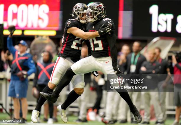 Erik Harris and Deion Jones of the Atlanta Falcons celebrate in the first quarter against the Carolina Panthers at Mercedes-Benz Stadium on October...