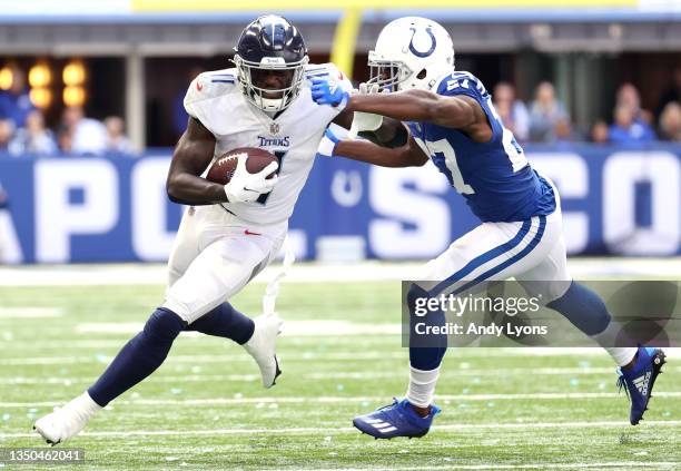 Brown of the Tennessee Titans carries the ball against Xavier Rhodes of the Indianapolis Colts in the first half at Lucas Oil Stadium on October 31,...